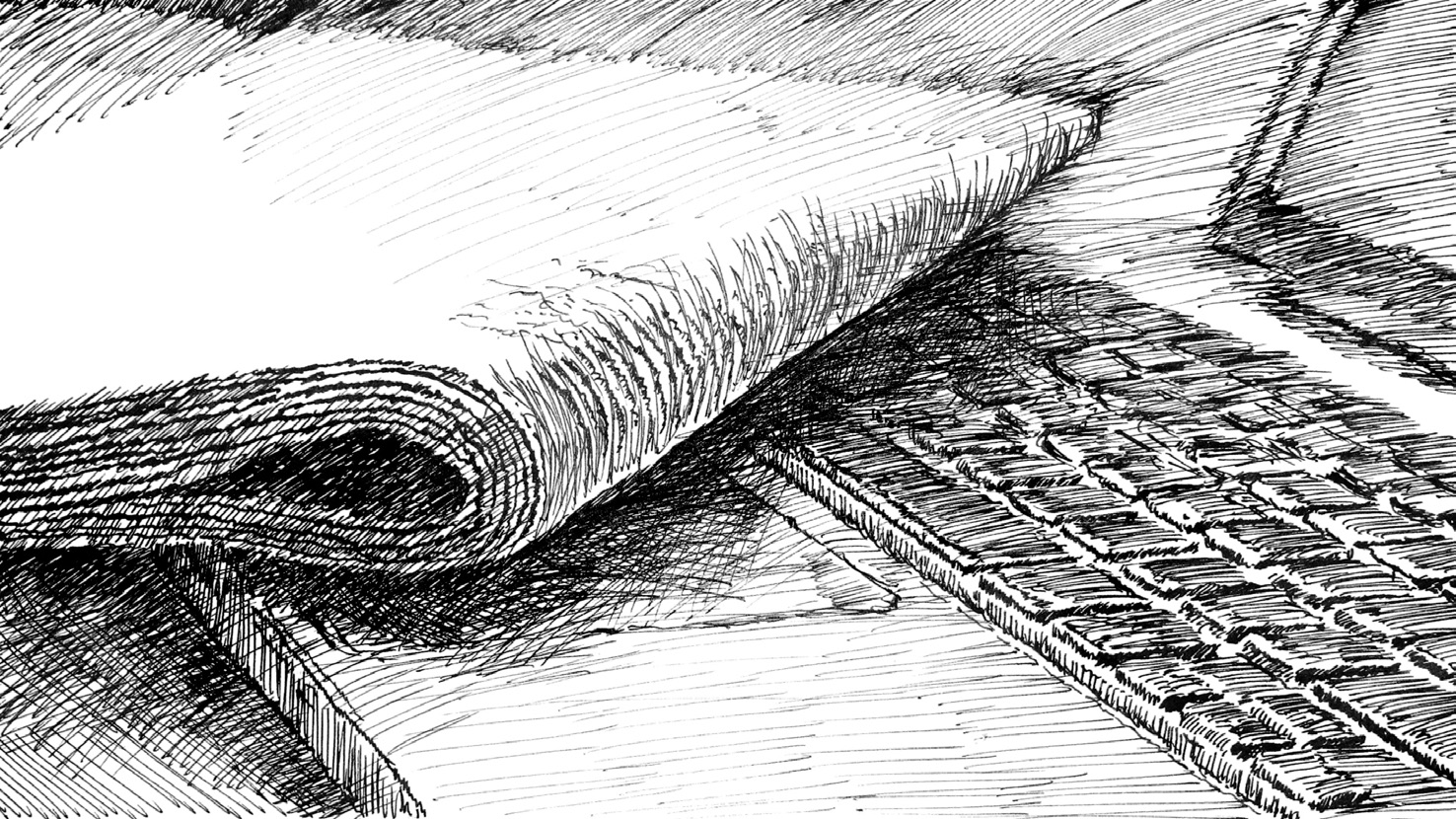 A newspaper lies on the keyboard of a notebook.